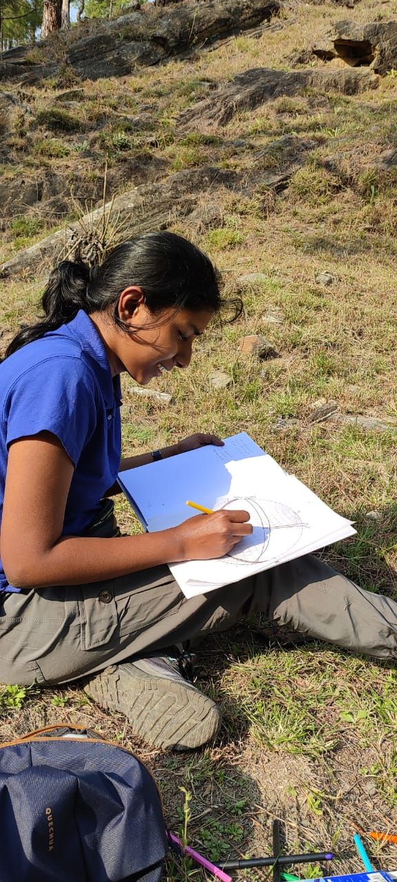 Gouri sketching in the field in Almora